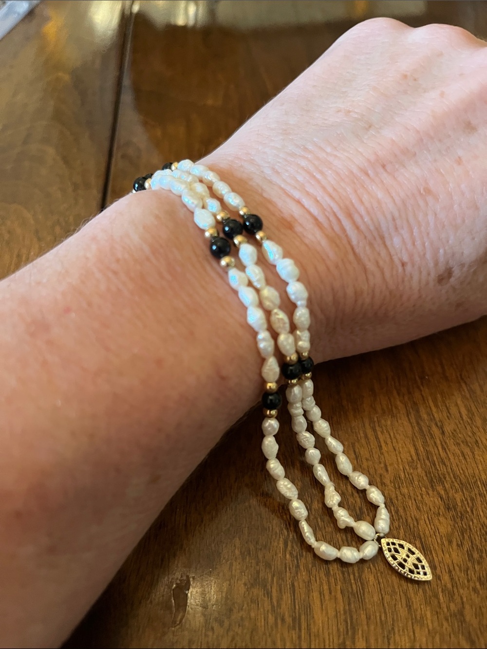 Women's White Pearl and Black Bead Bracelet with Gold Accent